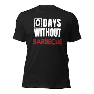 May include: Black t-shirt with white text that reads "0 DAYS WITHOUT BARBECUE".