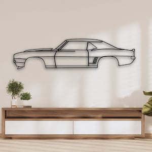 May include: A black metal silhouette of a classic car mounted on a white wall above a wooden entertainment center with two drawers. The car is a side profile of a 1960s muscle car.