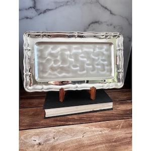 May include: A rustic wooden sign with the text "Welcome to our home" in white lettering. The sign features a distressed finish and a simple, inviting design, perfect for a front porch or entryway.