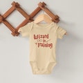 Wizard In Training Onesie - Wizard Toddler Tshirt, Wizard Bodysuit, HP Wizard Onesie, Baby Harry, New Baby Gift product logo