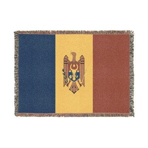 May include: A rectangular woven throw blanket featuring the national flag of Moldova with vertical stripes of blue, yellow, and red. The central yellow stripe displays the Moldovan coat of arms, featuring an eagle holding a cross and shield.