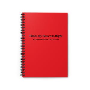 May include: A red spiral-bound notebook with the text "Times my Boss was Right" and "A Comprehensive Collection" printed in black. The notebook has a black spiral binding.