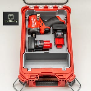 May include: Red and gray tool case with a clear lid, containing a red and black impact wrench, two batteries, and a charger. The case has a handle and latches. The brand name "Milwaukee" is visible on the tool. The logo "toolfinity" is in the upper left corner.