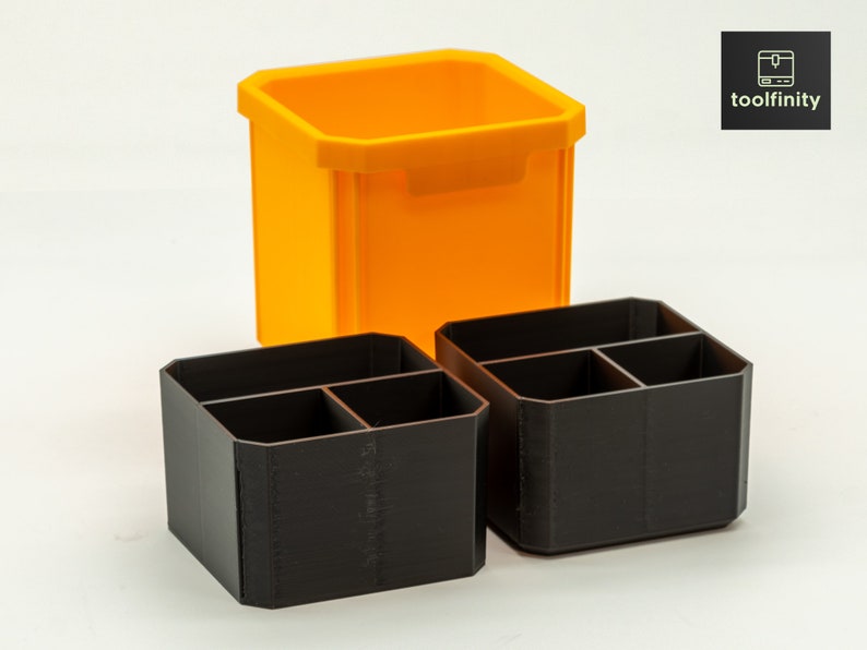May include: Two black plastic organisers with four compartments each, and a larger orange plastic container.