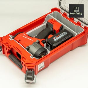 May include: A red and gray Milwaukee M18 Fuel impact wrench with a black battery pack stored inside a custom-fitted red plastic carrying case. The case features a clear lid and a black logo with the text toolfinity in the upper corner.