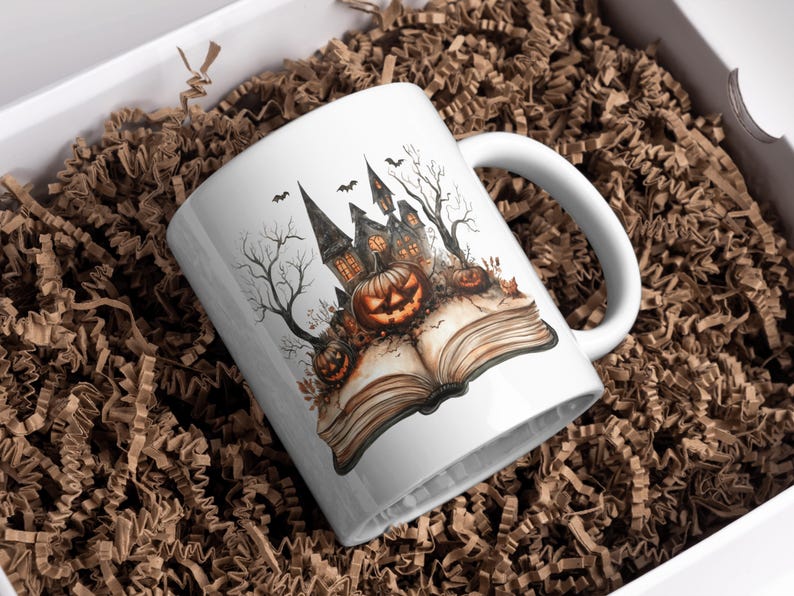 May include: White ceramic mug featuring a Halloween-themed design. The illustration depicts a spooky castle, jack-o'-lanterns, and bats, set against a backdrop of bare trees and an open book. The mug is presented in a white box with brown paper filler.