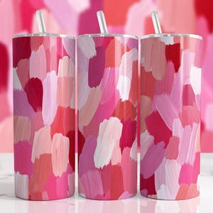 Peut inclure: Trois gobelets en acier inoxydable avec couvercles et pailles. Les gobelets présentent un motif abstrait vibrant de coups de pinceau dans des tons de rose, de rouge et de blanc. L'arrière-plan complète les gobelets avec un motif abstrait similaire.