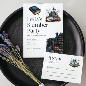 May include: A white invitation and RSVP card set with a watercolor illustration of a haunted house, books, and a skull. The invitation reads "Leila's Slumber Party" with event details. A bundle of lavender is in the foreground.