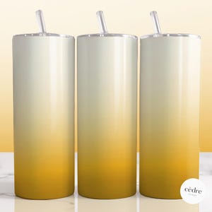 May include: Three stainless steel tumblers with a gradient design, transitioning from white to yellow. Each tumbler has a clear lid and a straw.