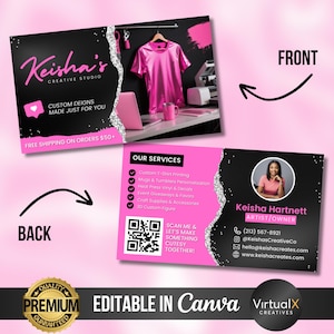 May include: Business card design for Keisha's Creative Studio. The front features the studio's name in pink script on a black background with a pink heart icon. The back includes a QR code and contact information. Services include custom t-shirt printing and event giveaways.