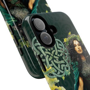 May include: A green and black phone case with a Celtic knot design and a woman with long dark hair and a green dress. The case has a raised camera bump with two lenses.