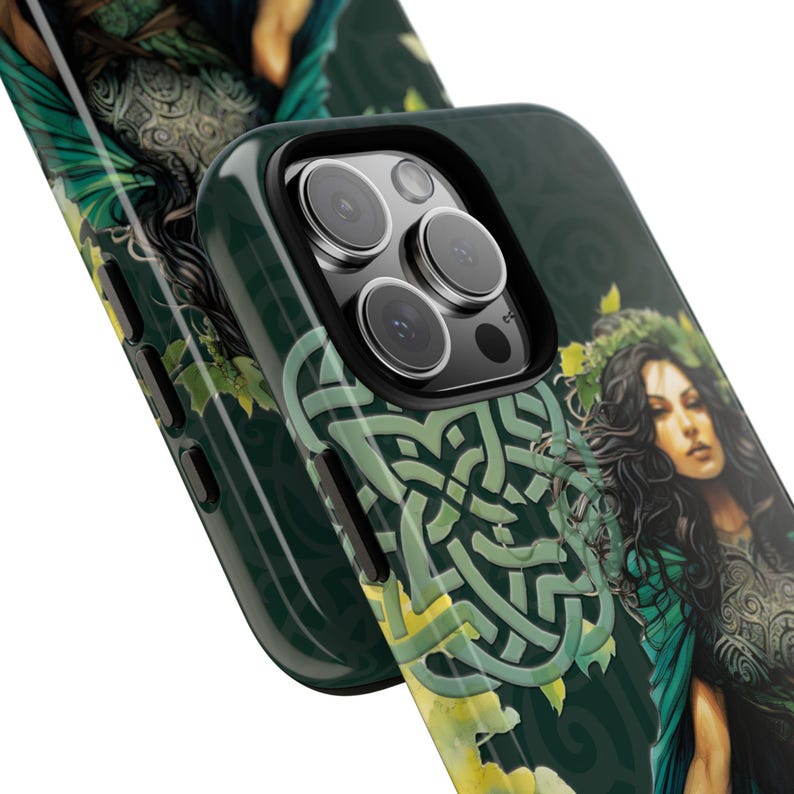 May include: A green and black phone case with a Celtic knot design and a woman with long dark hair and green wings. The case has a cutout for the phone's camera.