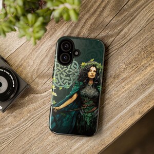 May include: A green and black phone case with a Celtic knot design and a woman in a green dress with a crown of leaves.