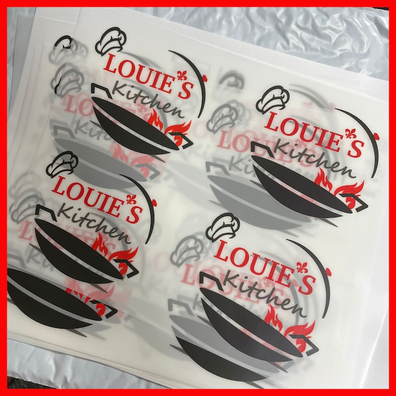 May include: Four white sheets of paper with a black and red logo that says "Louie's Kitchen" with a chef's hat and a wok with flames.