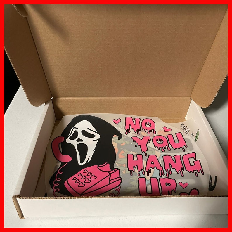 May include: A white cardboard box with a pink and black graphic design featuring a ghost face with a phone and the text "No You Hang Up".