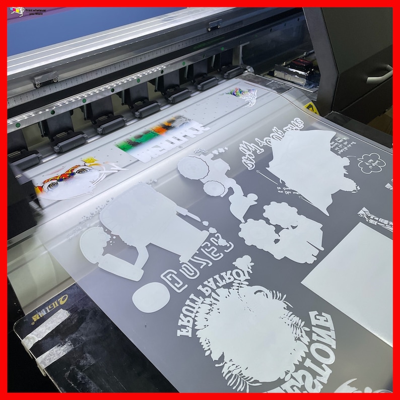 May include: A close-up of a large format printer printing white vinyl designs on a gray background. The designs include a silhouette of a person, a flower, and the word "DUKES".