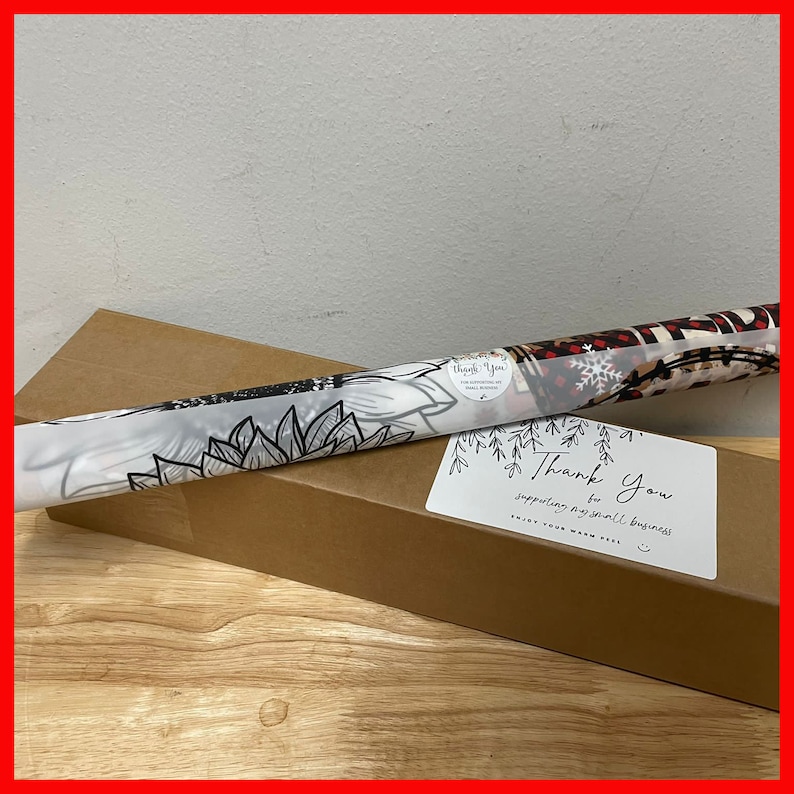 May include: A brown cardboard box with a rolled up print of a sunflower design. The box has a thank you sticker that says "Thank you for supporting my small business. Enjoy your warm feel."