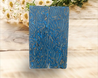 May include: Two blue and silver patterned wood blanks for crafting. The blanks have a swirling, organic pattern.