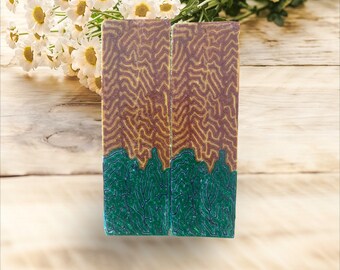 May include: Two wooden blanks with a brown and green marbled pattern. The blanks are rectangular and have a smooth surface.