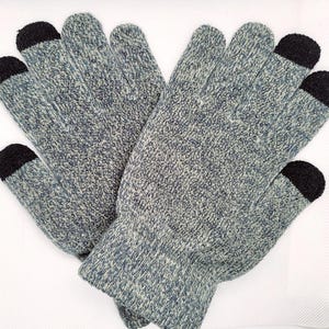 May include: A pair of grey and black touchscreen gloves. The gloves have black fingertips for using touchscreens.