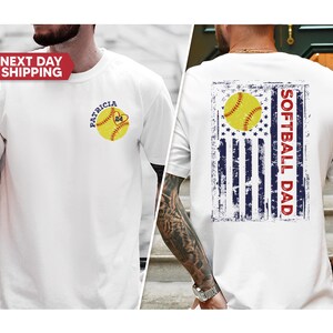May include: White t-shirt with a softball and the text "Patricia 24" on the front. The back of the shirt has a distressed American flag with a softball and the text "Softball Dad".
