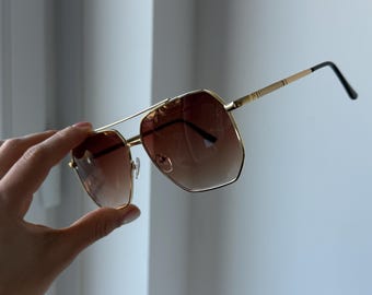 Bruine zonnebril met kleurverloop gouden montuur aviator