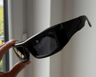 black lenses black frame futuristic sunglasses