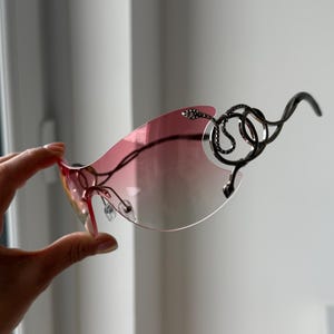 Pink lenses snake silver frame futuristic sunglasses