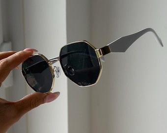 Black sunglasses golden frame and white sunglasses men