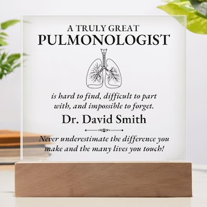 May include: A white acrylic plaque with a black and white illustration of lungs and the text "A Truly Great Pulmonologist is hard to find, difficult to part with, and impossible to forget. Dr. David Smith Never underestimate the difference you make and the many lives you touch!"