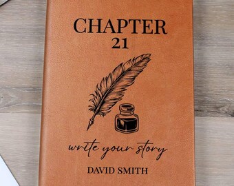 May include: A brown leather journal with the words "CHAPTER 21" and "write your story" printed on the cover. A feather and inkwell graphic is below the text. The name "DAVID SMITH" is printed at the bottom. A bookmark is visible.