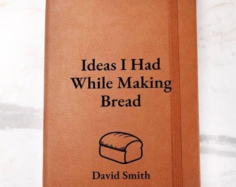 May include: A brown leather-bound journal with the text "Ideas I Had While Making Bread" and a simple illustration of a loaf of bread. The name "David Smith" is printed below the illustration.