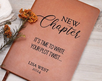 May include: A brown leather journal with the text "NEW Chapter" and "IT'S TIME TO WRITE YOUR PLOT TWIST..." in black lettering. The name "LISA WEST" and the year "2024" are also engraved on the front.
