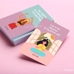May include: Two purple affirmation cards with illustrations of women. The first card says "Your WORTH has nothing to do with your body" and the second card says "I am in the Vibration of my future self".