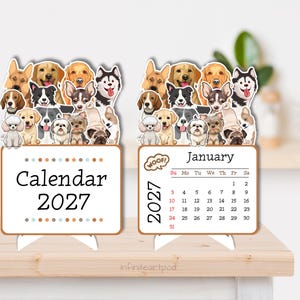 May include: Two desk calendars for 2027 featuring a colorful illustration of various dog breeds at the top. The left calendar displays the text Calendar 2027, while the right calendar shows the month of January 2027 with a grid of dates.