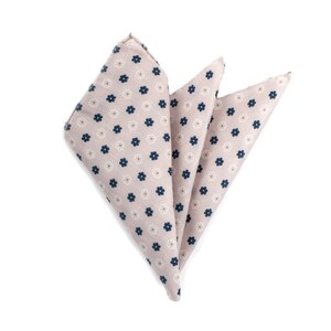 May include: A folded pocket square with a light beige background and a pattern of small white flowers with dark blue centres.
