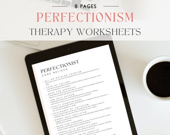 May include: A black and white digital tablet displaying a worksheet titled "Perfectionist Core Beliefs" with a checklist of perfectionist tendencies. The tablet is on a white surface with a cup of coffee to the right.