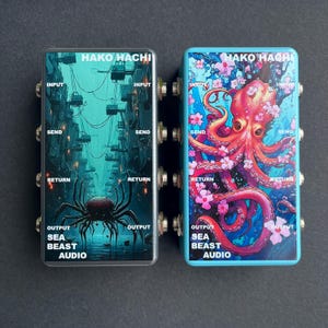 May include: Two rectangular audio effect pedals. One features a dark cityscape with a spider, the other a blue background with an octopus and cherry blossoms. Both have "HAKO HACHI" and "SEA BEAST AUDIO" printed on them, with input, send, return, and output labels.