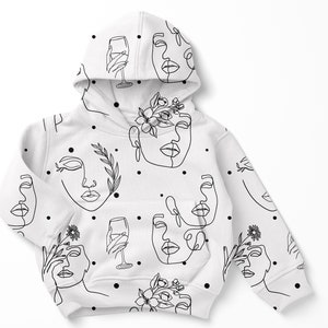 May include: White hoodie featuring a black line drawing pattern of faces, flowers, and wine glasses. The pattern is repeated across the hoodie.