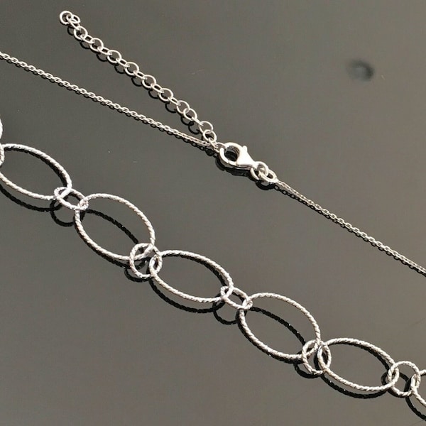 Collier argent massif 925/000 anneaux entrelacés chaîne ajustable