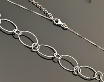 Collier argent massif 925/000 anneaux entrelacés chaîne ajustable