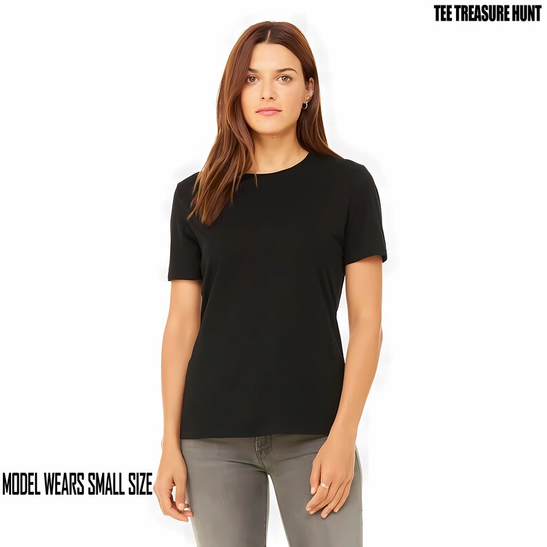 May include: A black short-sleeved t-shirt with a crew neck. The model is wearing a size small.