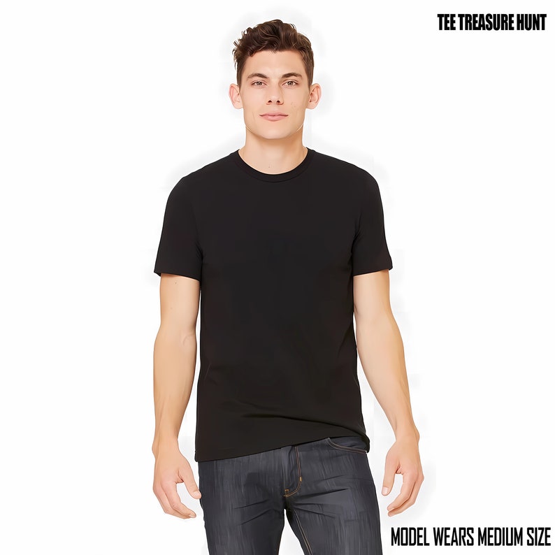 May include: A black t-shirt with a crew neck and short sleeves. The model is wearing a medium size.