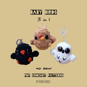 May include: Three crocheted baby bird keychains, a brown chick, a black bird, and a white owl. The keychains are labeled "BABY BIRDS 3 in 1 no sew PDF CROCHET PATTERNS BY HOOKSTORIES".