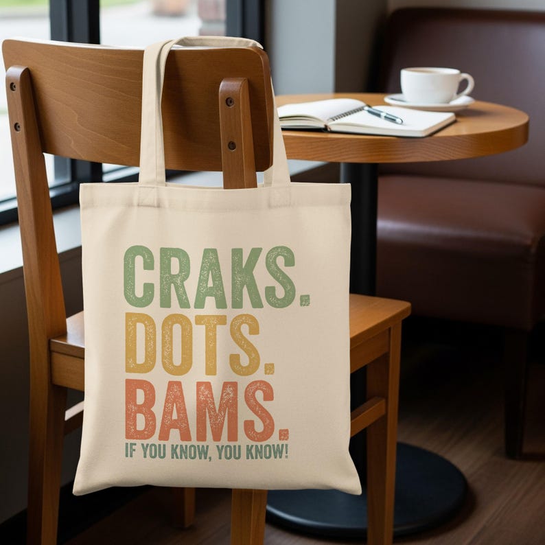 Canvas tote bag with "Craks. Dots. Bams. If you know, you know!" text.