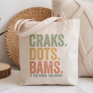 Canvas tote bag with "Craks. Dots. Bams. If you know, you know!" text.