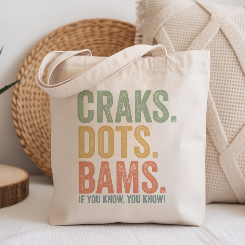 Canvas tote bag with "Craks. Dots. Bams. If you know, you know!" text.