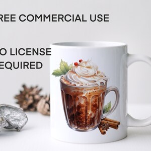 May include: White ceramic mug with a design of a glass of hot chocolate topped with whipped cream and cinnamon sticks. The text "FREE COMMERCIAL USE NO LICENSE REQUIRED" is printed on the mug.