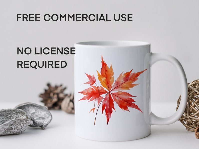 May include: White ceramic mug with a red and orange watercolor maple leaf design. The mug has a black handle and the text "FREE COMMERCIAL USE NO LICENSE REQUIRED" is printed on the mug.