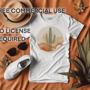 May include: White t-shirt featuring a graphic of a green cactus in a desert landscape. The text "FREE COMMERCIAL USE NO LICENSE REQUIRED" is visible on the image.